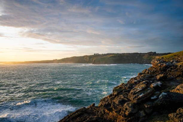 istock sunset on slope point in New Zealand with Cliffs and ocean 2098084657