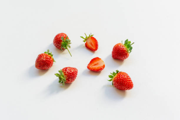 istock Red berry strawberry with leaves isolated on white background 2098108907