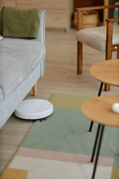 istock White Robot Vacuum Mopping Floors at Home 2098120235