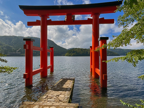 Hakone, Shizuoka Prefecture, Japan - August 12, 2023: Beyond the Shores: Panoramic Hakone Red Jinja Torii Gate lake