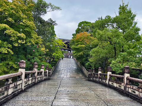 Kyoto, Japan - August 10, 2023: Sacred Portal: Fushimi Inari Taisha's Iconic Entrance Bridge