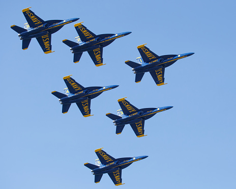 Suisun City, California / USA - March 17, 2024: An image of six Blue Angel jets flying in formation over a Suisun City, California neighborhood while performing at the \