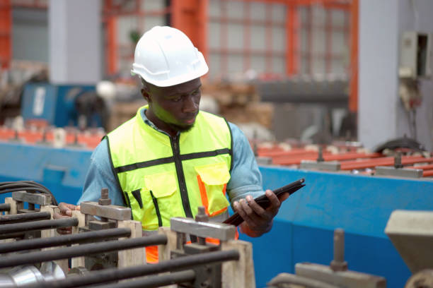 istock Man working in factory. 2098192489