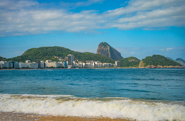Niteroi, Brazil - December 10, 2021: Tourists enjoying the daylight in Sossego Beach. This is a famous place and tourist attraction in the Rio de Janeiro State.