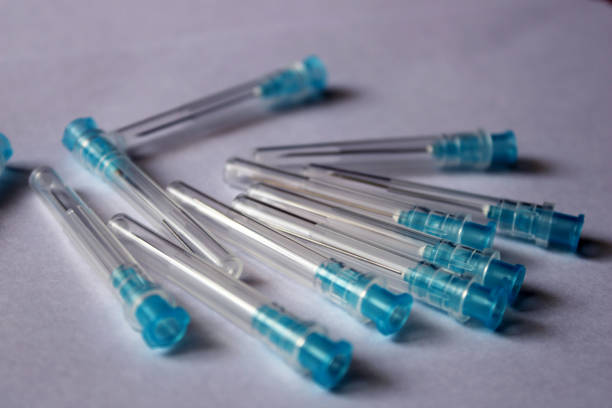 istock Many blue medical needles on a white background. 2098271610