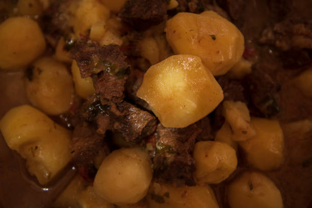 a potato and meat in a plate
