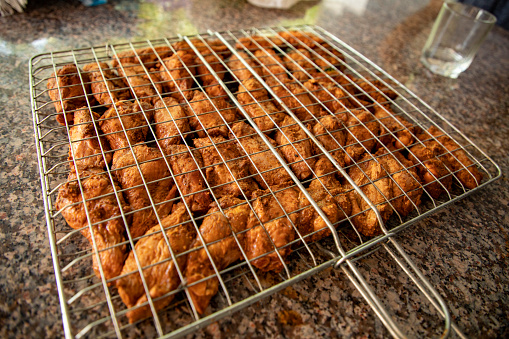 a chicken arranged in a griller