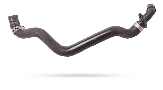 Black plastic hose of the car engine cooling system on a white isolated background in a photo studio for replacement during repair or for a catalog of spare parts for sale on auto disassembly.