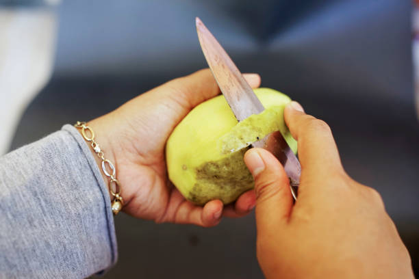 istock close up open the ripe fresh mango with a knife 2098370736
