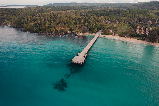 Bay and pier on the island in the morning, high angle