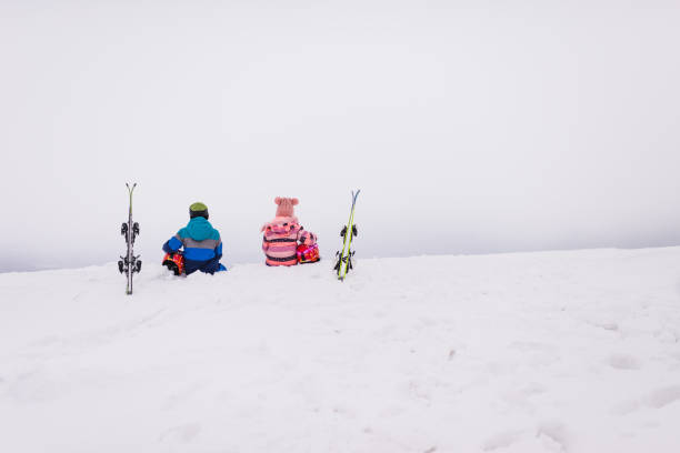 Beautiful children relaxing on the top of the mountain. Copy space.