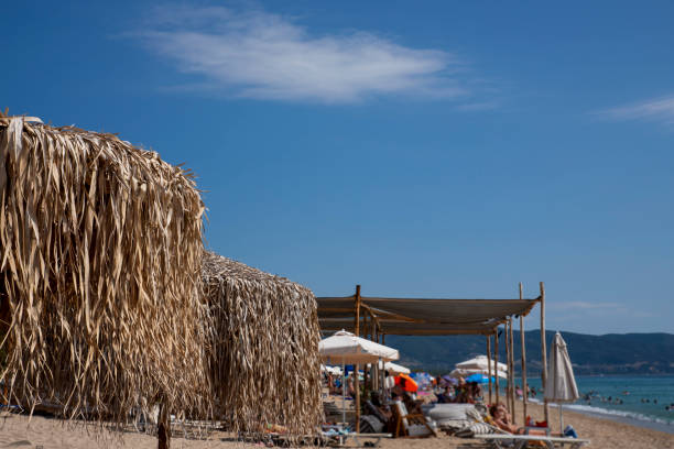 Umbrella made from palm tree leaves at the beach. Tropical style