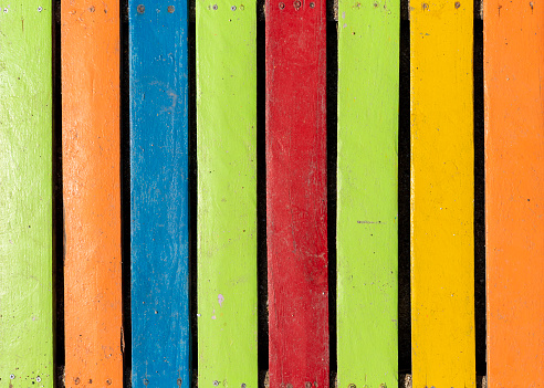 Colorful wooden boardwalk. Wooden boards. Empty space, for text or logo.