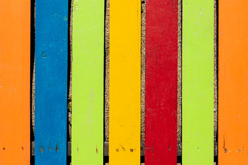 Colorful wooden boardwalk. Wooden boards. Empty space, for text or logo.