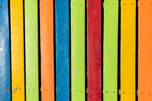Colorful wooden boardwalk. Wooden boards. Empty space, for text or logo.