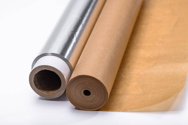 istock Aluminum foil and baking paper in large rolls on a white background 2098425705