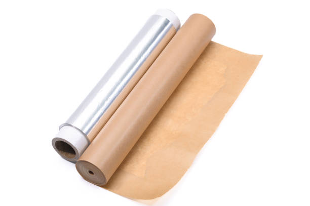 istock Baking paper and aluminum foil in rolls on a white background 2098426256