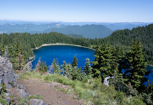 Beautiful blue Summit lake with rolling mountains in the background. Mt Rainier National Park. Washington State.