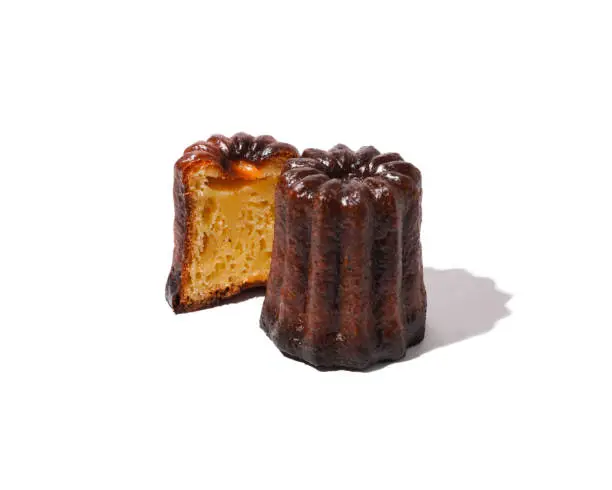 french pastry canele on a white background