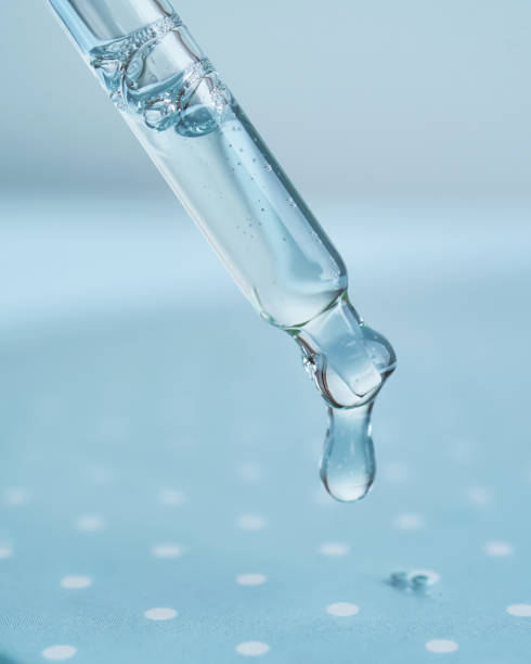 istock Pipette with serum on a blue background. 2098486822