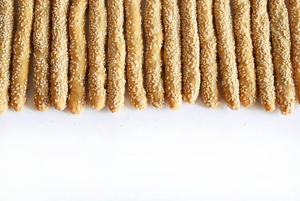 Textured abstract full frame background. Sesame sticks.