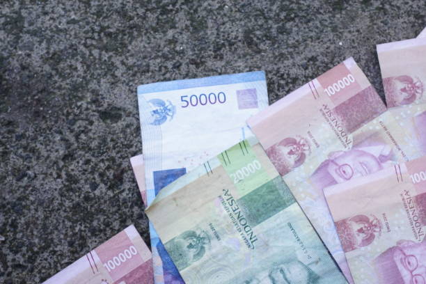 istock Indonesian money is neatly lined up with various denominations 2098489969