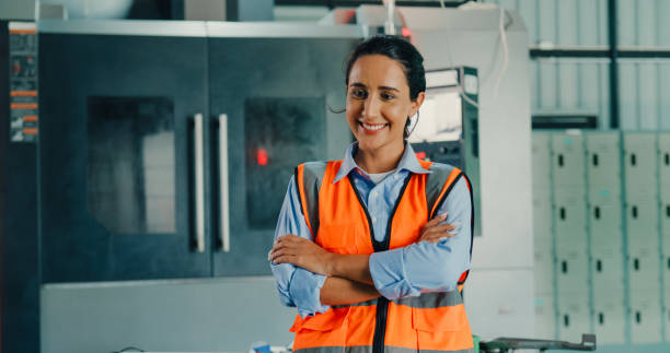 istock Professional female industrial engineers smiling and looking at camera in manufacturing factory. Engineering and sustainable production plant. 2098493680