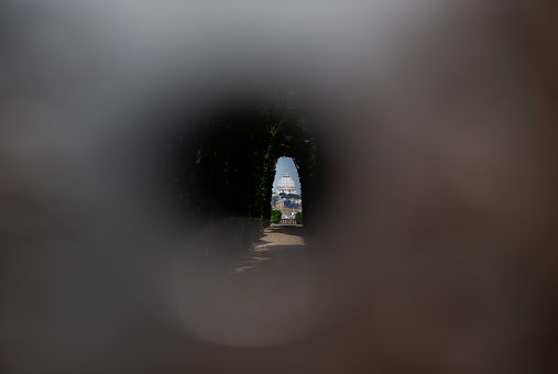 The Aventine keyhole to see domes of Rome seen through the Key Hole