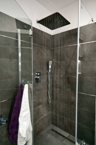 istock Grey bathroom shower corner in modern home 2098517589