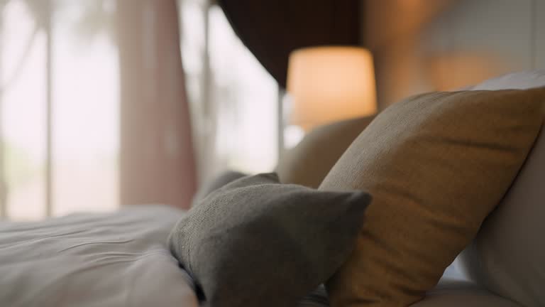 bedroom interior concept Close-up of pillow soft linens over a simplicity bedroom home interior background