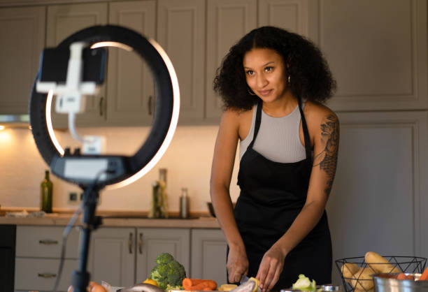 istock Woman cooking for a webinar 2098539693
