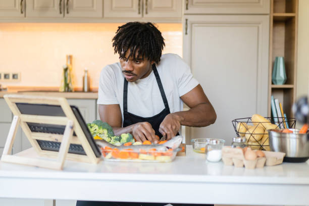 istock Learning to prepare a healthy meal with a live streaming cooking course 2098543614