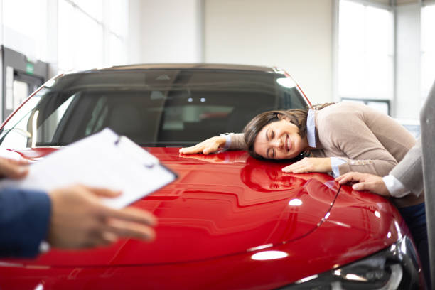 istock Happy couple buying new car 2098563807