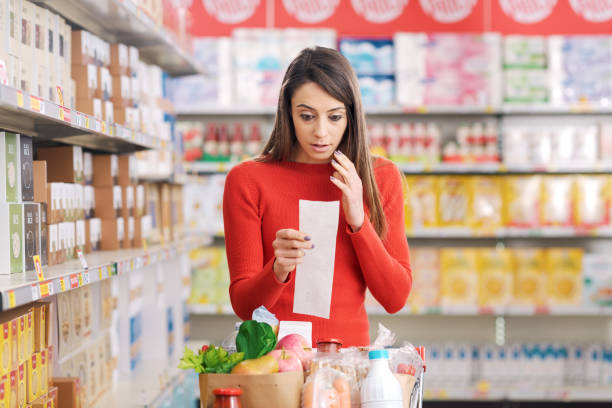istock Shocked woman checking an expensive grocery list 2098587207
