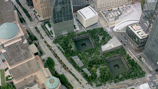 Aerial view of National September 11 Memorial & Museum surrounded by city, Lower Manhattan, New York City, New York State, USA.