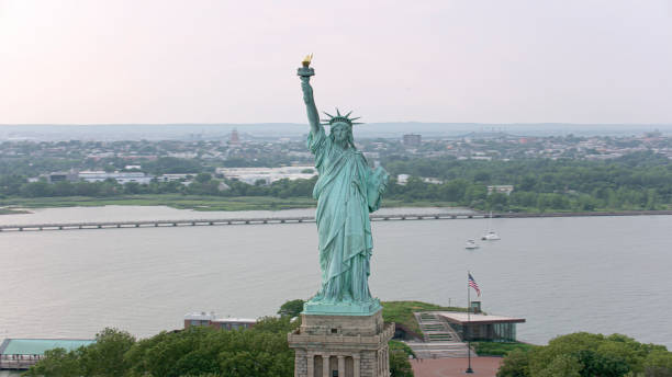 Statue of Liberty half buried in the sand