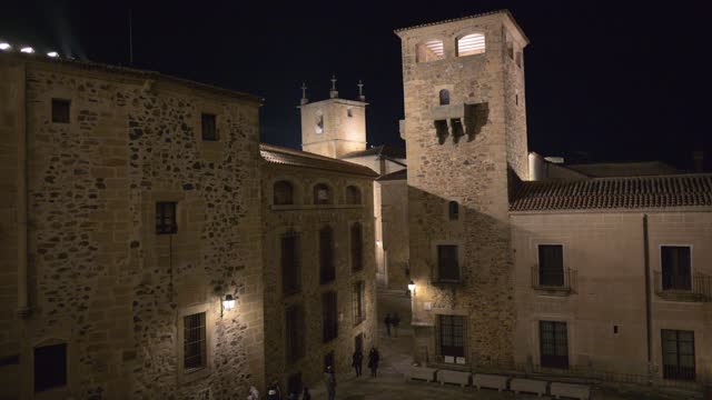 Nighttime stroll through the historic streets of Caceres old town, Spain