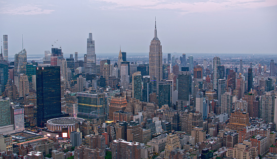 New York, USA. 09.21.2022. Beautiful aerial view of densely built-up skyscrapers of Manhattan and Hudson river.