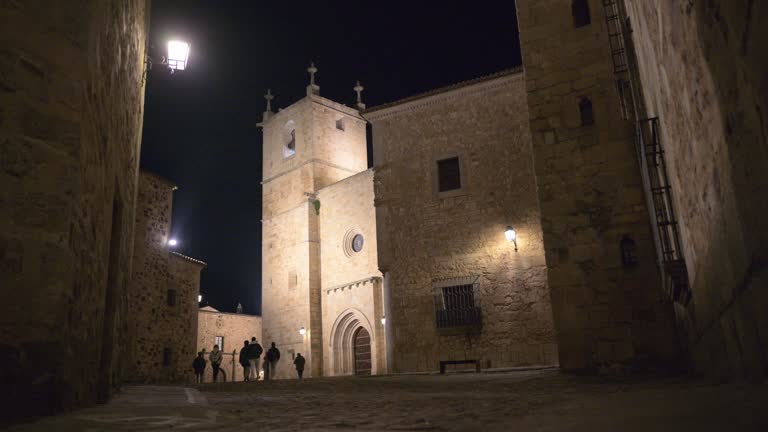 Nighttime stroll through the historic streets of Caceres old town, Spain