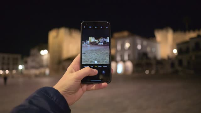 Capturing the historic charm of Caceres old town at night with smartphone