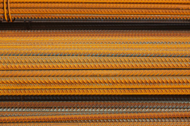 Stacked packs of stored rusty fittings in a warehouse.