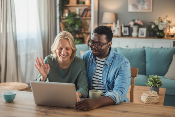 istock Happy multiethnic couple making a video call 2098679674