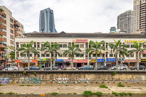 Kuala Lumpur, Malaysia - January 9th 2024:  Old and new architecture combining modern high rise architecture with buildings from the colonial time in the Malaysian capital