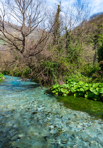 Water flows from the Blue Eye, a natural water spring in the Albanian mountains