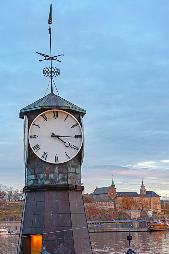 Oslo, Norway - October 30, 2016: Aker Brygge Clock Tower in Capital City at Dusk.
