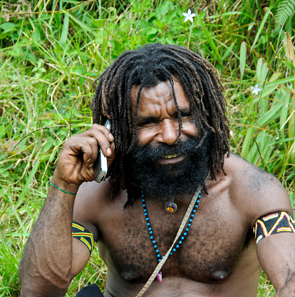 Baliem Valley, Wamena, West Papua, Indonesia - oct 31, 2010 : close-up of a young  man with rasta hair from a Dani tribe,  in  Dugum Hills, Baliem Valley, West Papua