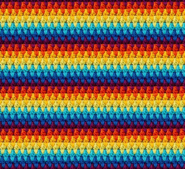 istock Seamless knitted texture in afghan style. The pattern is crocheted from multicolored cotton yarn. 2098765833