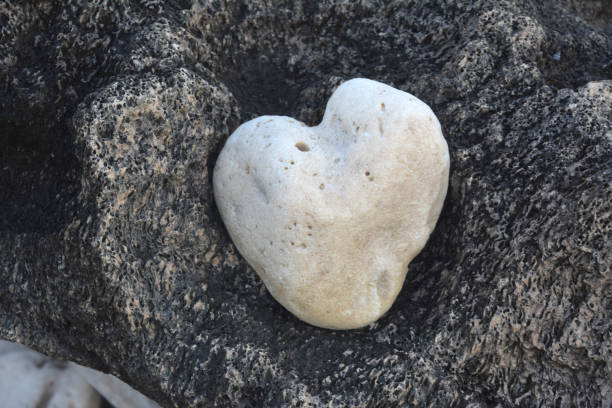 istock Beautiful Heart Shaped Stone Softened By Ocean Waves 2098782460