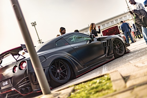 Vicenza, Italy 19 March 2024: Elaborately tuned black Nissan GTR on display at a car show.