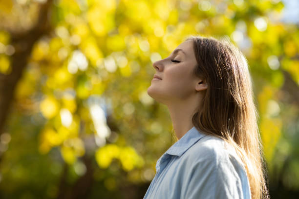 istock Woman with closed eyes in nature 2098822188
